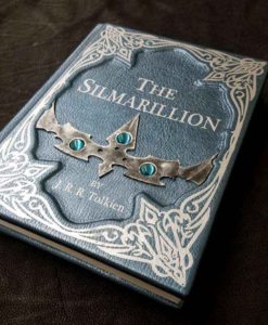 Tolkien's The Silmarillion, bound in vibrant blue leather, gilded in silver, and decorated with wood and gems.