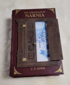 CS Lewis' Chronicles of Narnia -- bound in red leather with a working hinged wooden wardrobe on the front.